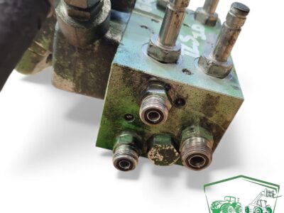 Blok zaworu amortyzacji osi TLS AL205562 John Deere 6050R