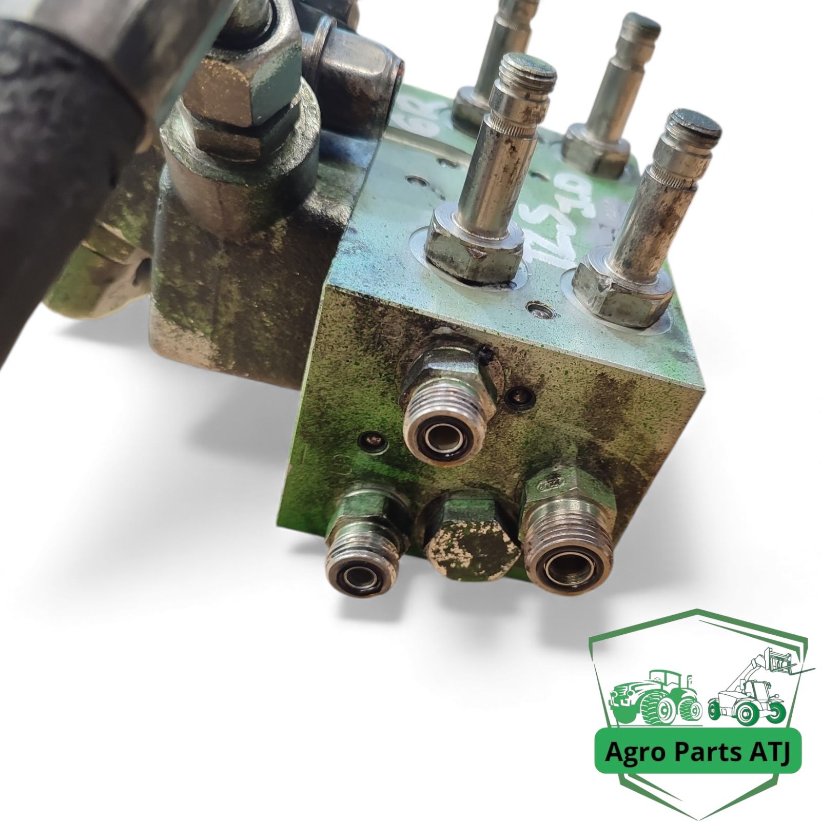 Blok zaworu amortyzacji osi TLS AL205562 John Deere 6050R