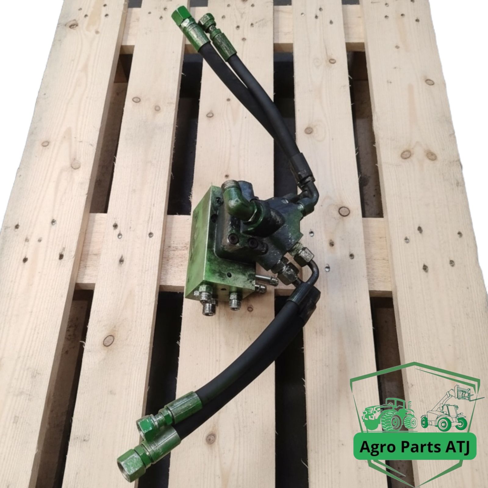 Blok zaworu amortyzacji osi TLS AL205562 John Deere 6050R