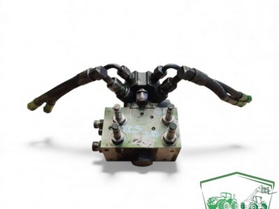 Blok zaworu amortyzacji osi TLS AL205562 John Deere 6050R
